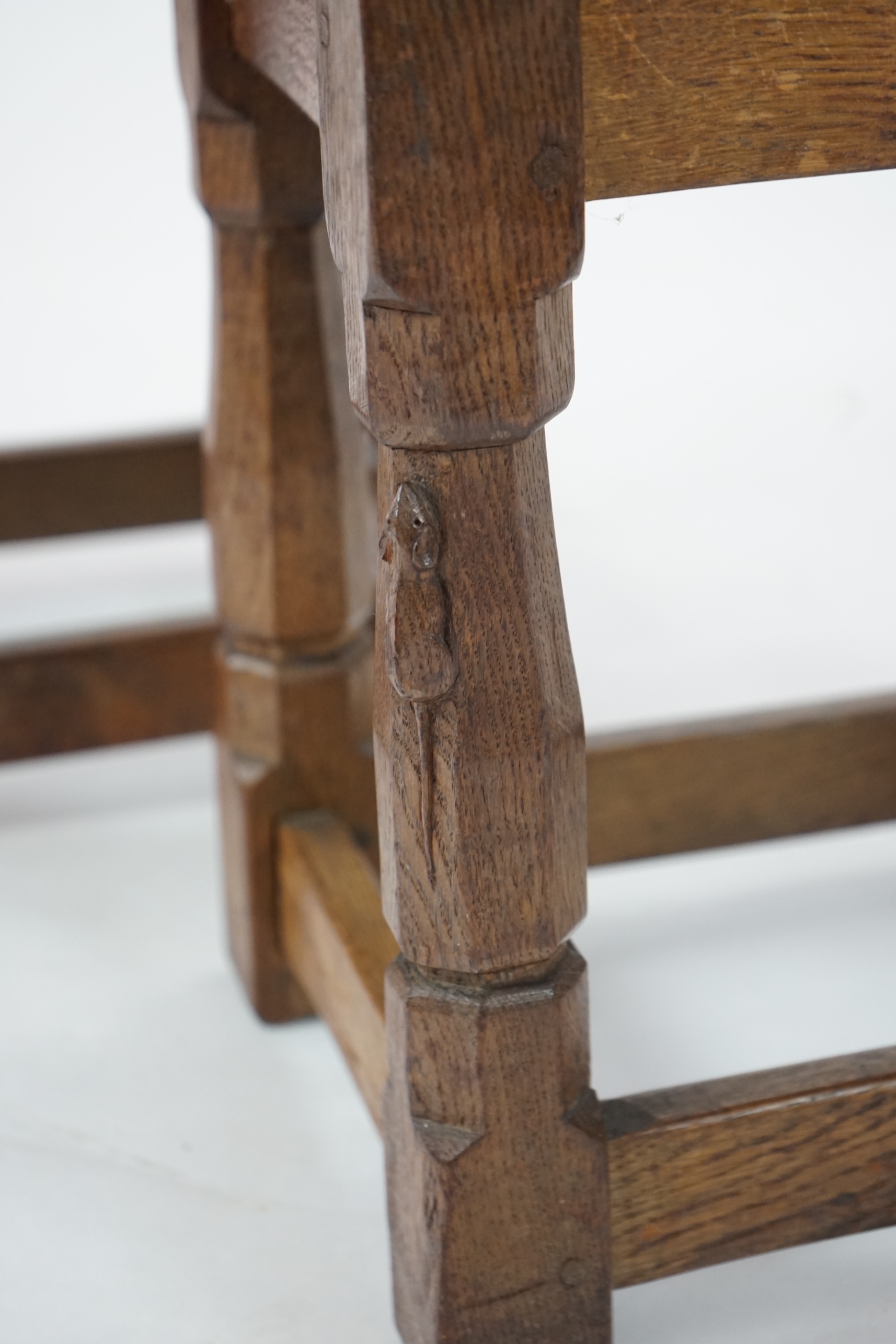 A pair of Robert 'Mouseman' Thompson burr oak stools, 1930s